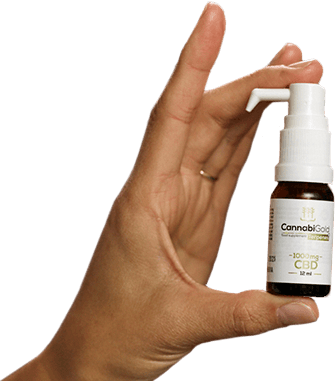 hand holding cannabigold oil bottle