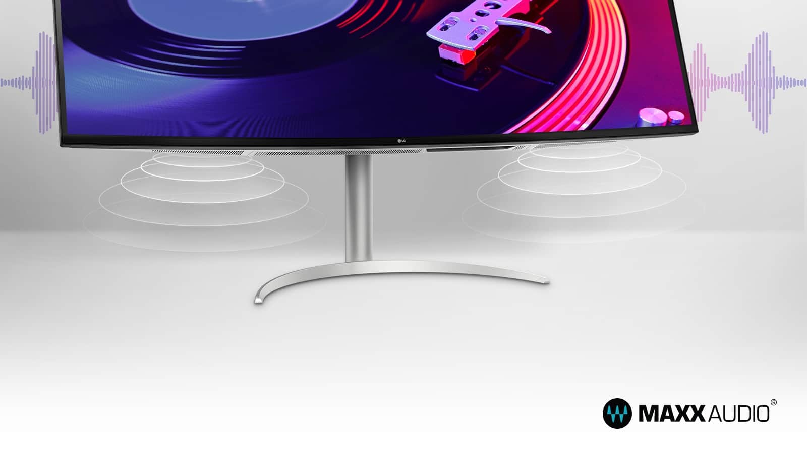 Pokazuje dwa głośniki stereo o mocy 10 W i napis MaxxAudio® na dole monitora.
