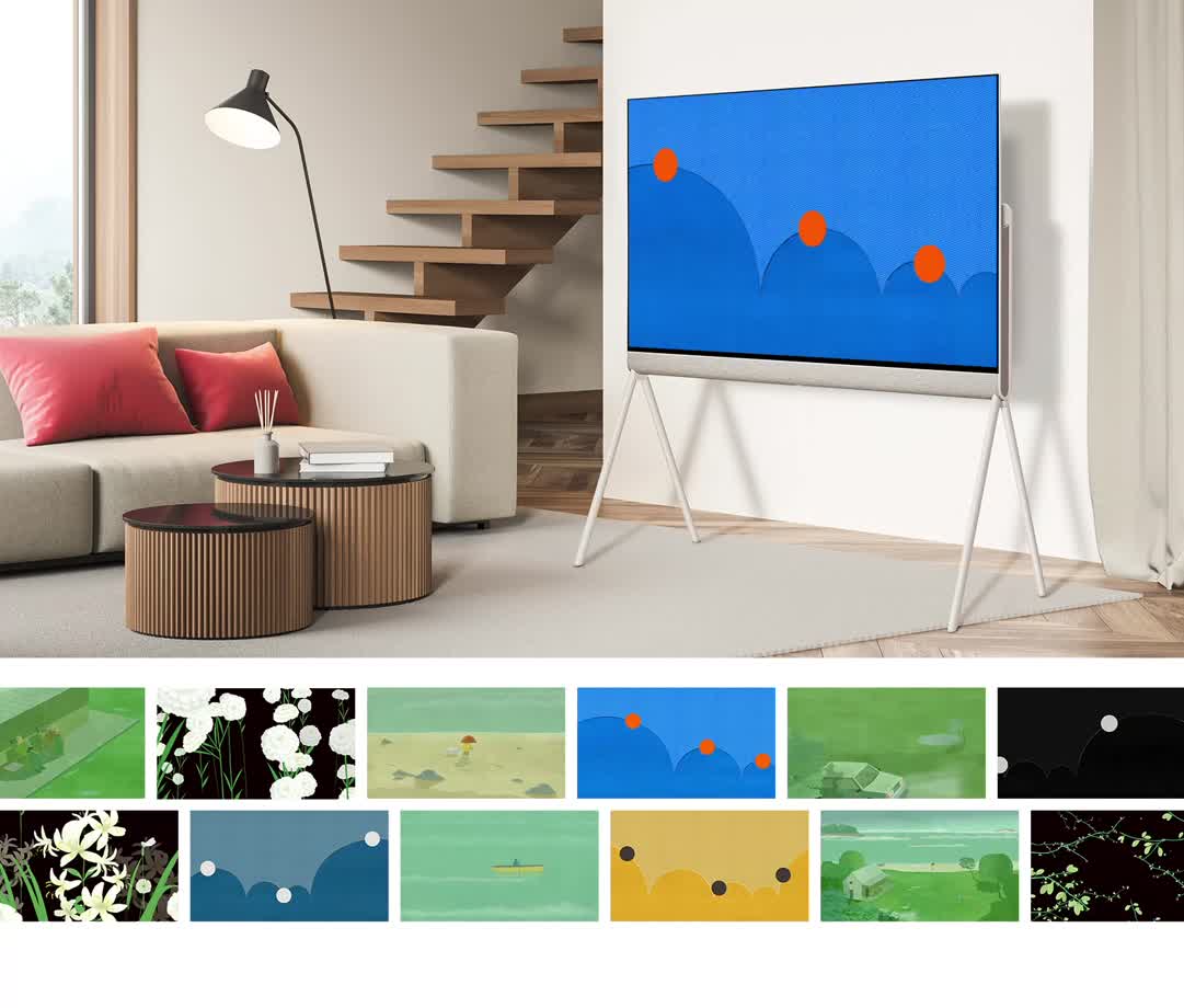Позуйте у вітальні з синім витвором мистецтва з помаранчевими колами на екрані. Колеса підстрибують, коли малюнок змінює колір із синього на гірчичний. Нижче наведено різноманітні твори мистецтва на вибір, серед яких: Пара, що сидить надворі, Білі гвоздики, Дитина та собака на скелястому пляжі, Яскравий синій абстрактний твір, Автомобіль із увімкненими вогнями під деревом, Чорний абстрактний твір, Білі нарциси, що відкидають тінь, Прохолодний Синя абстрактна робота, людина, що веслує на човні в морі, робота гірчичного кольору, будинок на узбережжі, пагони листя на гілках дерев.
